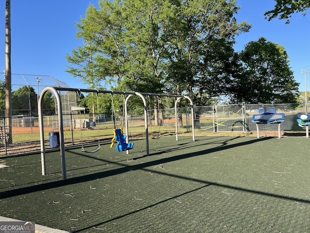 communal playground featuring fence