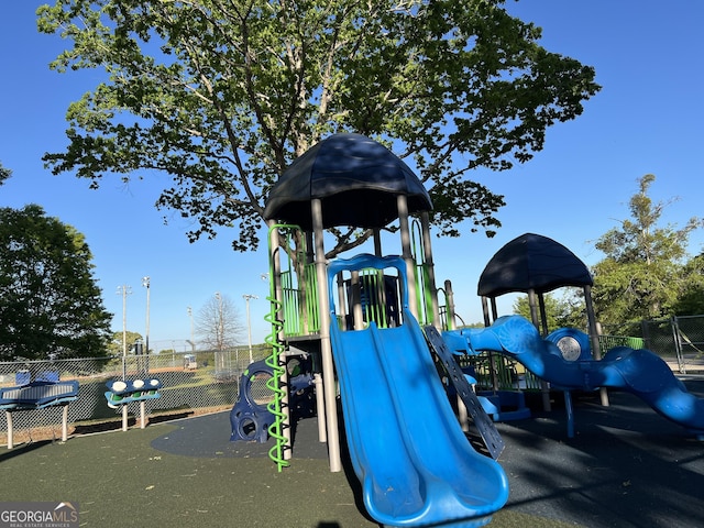 community play area featuring fence