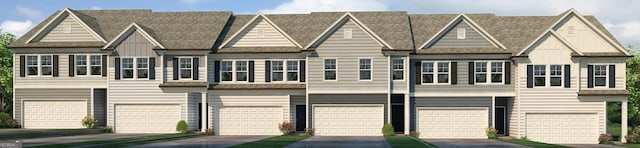 38 Buckingham Ln Unit 232, Hoschton, GA 30548 - view of front of home with board and batten siding, a garage, and roof with shingles