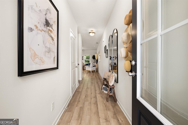 38 Buckingham Ln Unit 232, Hoschton, GA 30548 - hallway featuring light wood-style flooring and baseboards