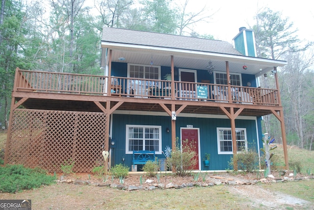 249 Spruce Creek Rd, Lakemont, GA 30552 - rear view of house with a chimney, a wooden deck, and a shingled roof