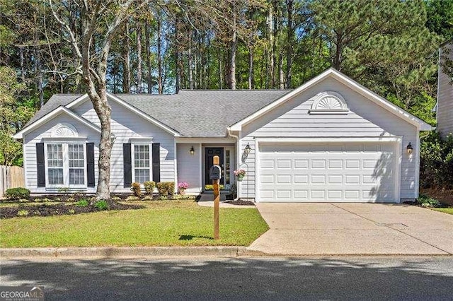 single story home featuring driveway, a garage, and a front lawn