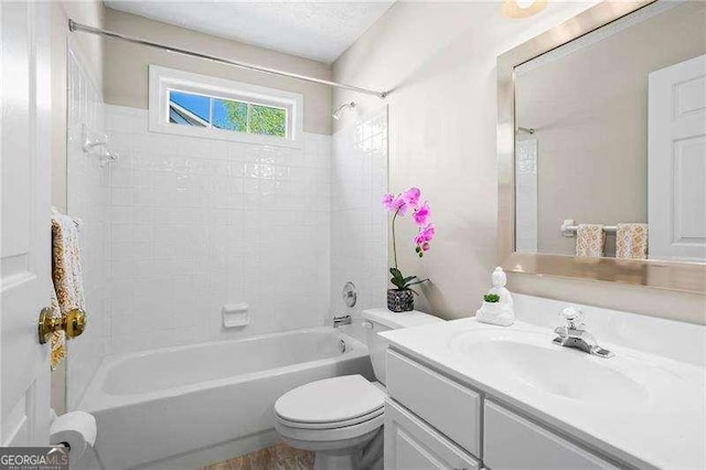 bathroom featuring vanity,  shower combination, and toilet