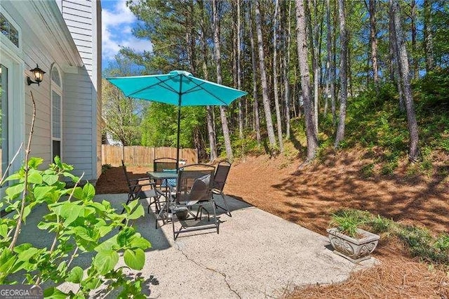 view of patio / terrace with outdoor dining area and fence