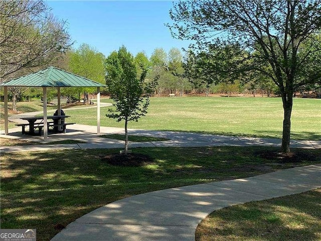 surrounding community featuring a gazebo and a yard