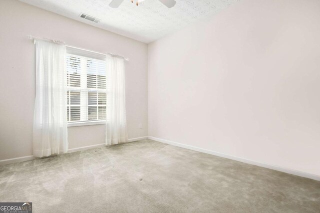 4573 Caleb Xing Unit 20, Powder Springs, GA 30127 - carpeted spare room with visible vents, baseboards, a ceiling fan, and a textured ceiling