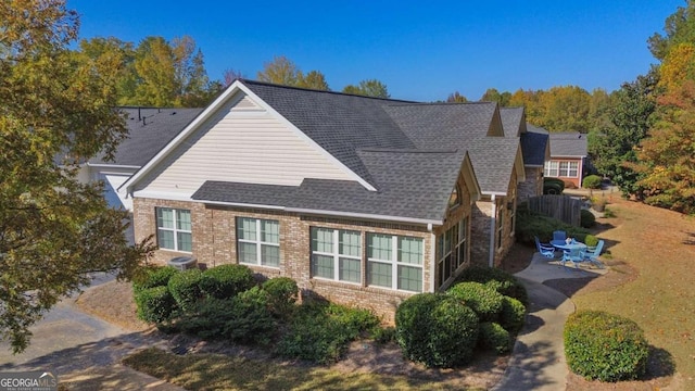 4573 Caleb Xing Unit 20, Powder Springs, GA 30127 - view of property exterior with a patio area, brick siding, and central AC unit
