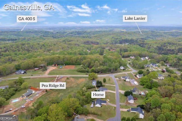 7310 Pea Ridge Pl, Gainesville, GA 30506 - birds eye view of property with a wooded view