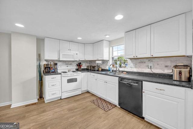 7310 Pea Ridge Pl, Gainesville, GA 30506 - kitchen with a sink, white appliances, dark countertops, and white cabinets