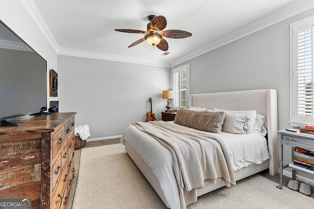 bedroom with crown molding, baseboards, ceiling fan, and light carpet