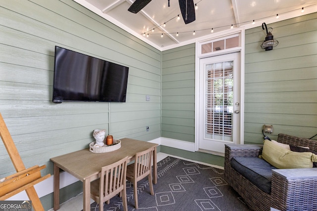 exterior space with wood walls and track lighting