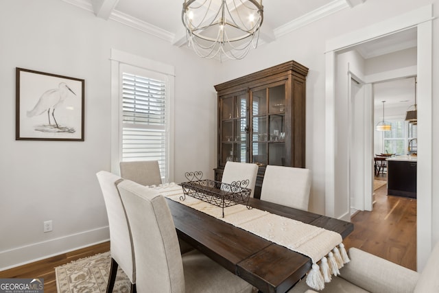 105 Whispering Oaks Ln, Saint Marys, GA 31558 - dining space featuring a wealth of natural light, a notable chandelier, dark wood-style flooring, and ornamental molding