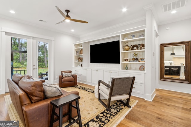 105 Whispering Oaks Ln, Saint Marys, GA 31558 - living room with ornamental molding, visible vents, and light wood-style floors
