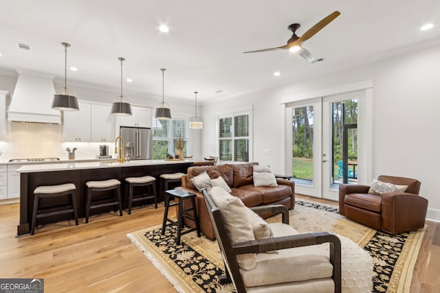 105 Whispering Oaks Ln, Saint Marys, GA 31558 - living area featuring crown molding, light wood finished floors, ceiling fan, and recessed lighting