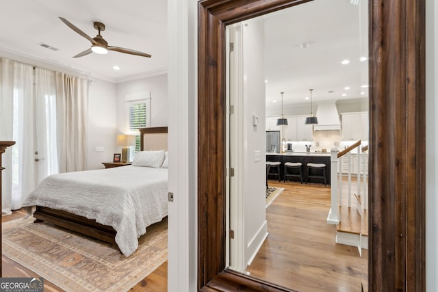 105 Whispering Oaks Ln, Saint Marys, GA 31558 - bedroom featuring light wood-style flooring, ornamental molding, visible vents, and recessed lighting