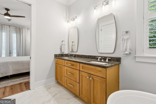 105 Whispering Oaks Ln, Saint Marys, GA 31558 - bathroom featuring a sink, ceiling fan, crown molding, double vanity, and marble finish floor