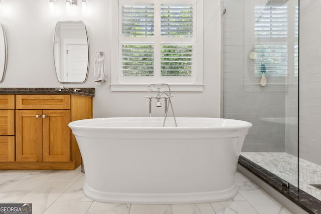 105 Whispering Oaks Ln, Saint Marys, GA 31558 - full bath with tiled shower, vanity, marble finish floor, and a freestanding tub