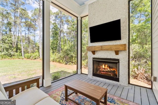 105 Whispering Oaks Ln, Saint Marys, GA 31558 - sunroom / solarium featuring a glass covered fireplace