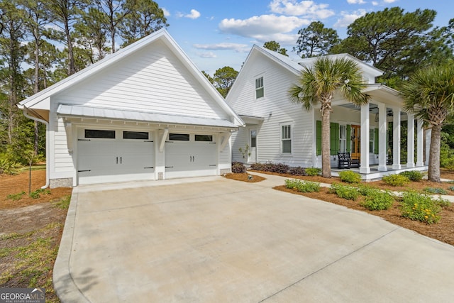 105 Whispering Oaks Ln, Saint Marys, GA 31558 - view of front of property featuring a porch and a garage