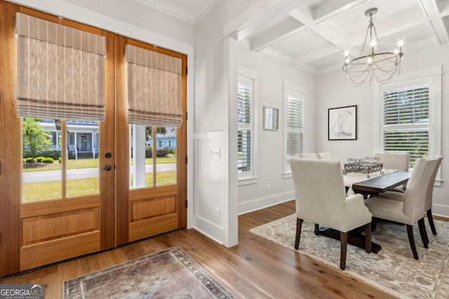 105 Whispering Oaks Ln, Saint Marys, GA 31558 - dining room featuring a notable chandelier, french doors, beamed ceiling, coffered ceiling, and wood finished floors