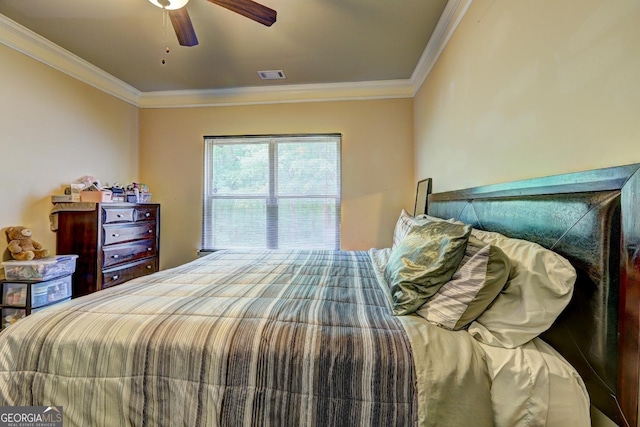 bedroom with crown molding, a ceiling fan, and visible vents