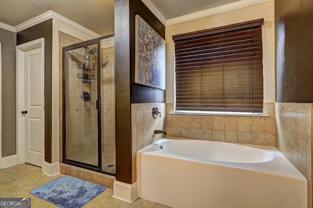 bathroom with tile patterned floors, a bath, ornamental molding, and a stall shower