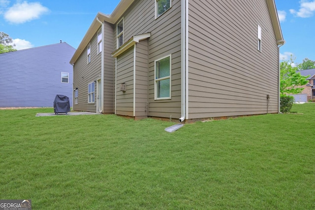 view of home's exterior featuring a lawn