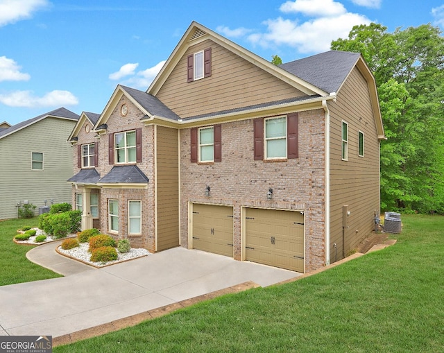 craftsman house with a front yard, central AC unit, a garage, brick siding, and driveway