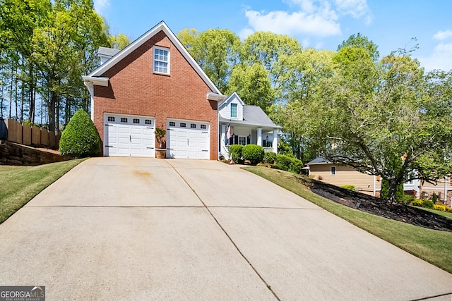 561 Valleyside Dr, Dallas, GA 30157 - traditional home with a garage, brick siding, and concrete driveway