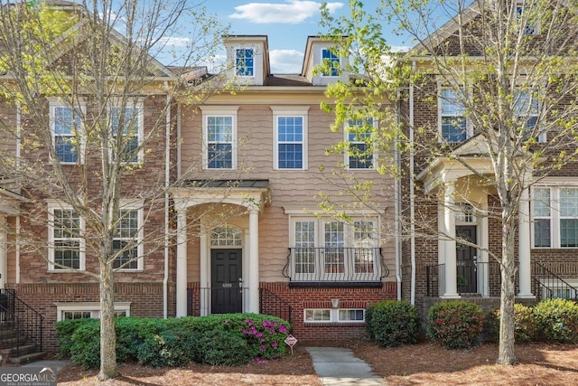 view of property featuring brick siding