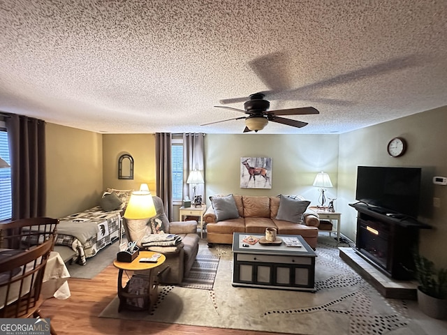 80 Hill Farm Rd, Alamo, GA 30411 - living area with a textured ceiling, ceiling fan, and wood finished floors