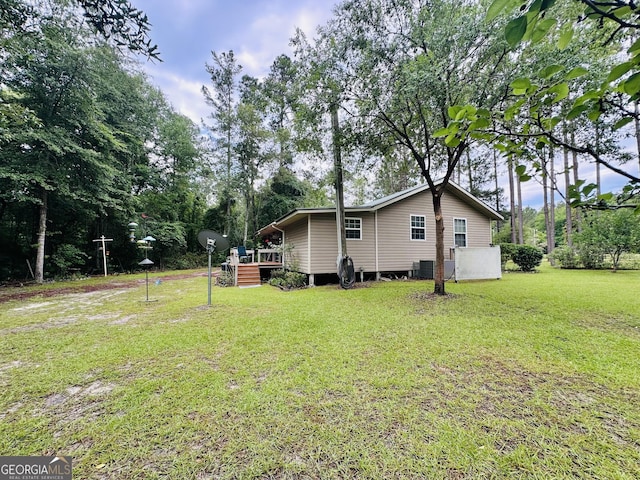 80 Hill Farm Rd, Alamo, GA 30411 - rear view of property featuring a deck, a lawn, and central air condition unit