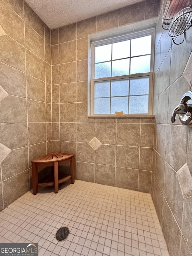 80 Hill Farm Rd, Alamo, GA 30411 - bathroom with tiled shower and a textured ceiling