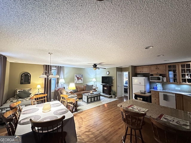 80 Hill Farm Rd, Alamo, GA 30411 - dining area featuring a textured ceiling, a ceiling fan, and wood finished floors