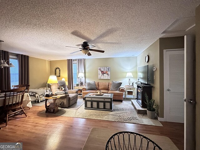80 Hill Farm Rd, Alamo, GA 30411 - living area with a ceiling fan, wood finished floors, and a textured ceiling