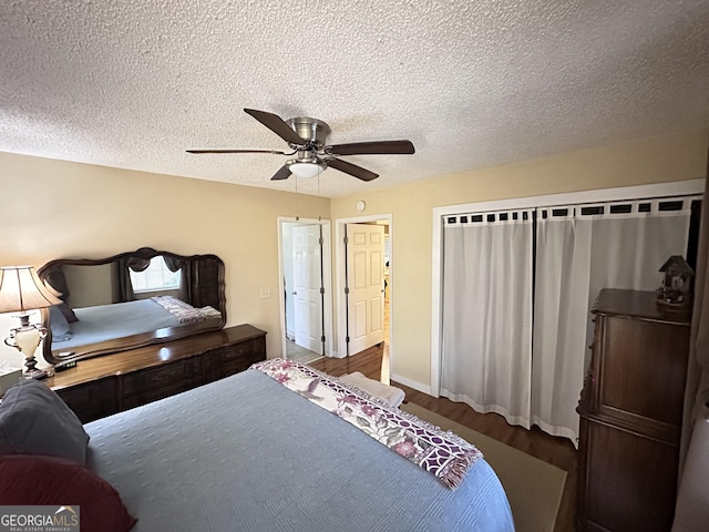 80 Hill Farm Rd, Alamo, GA 30411 - bedroom featuring wood finished floors, ceiling fan, and a textured ceiling
