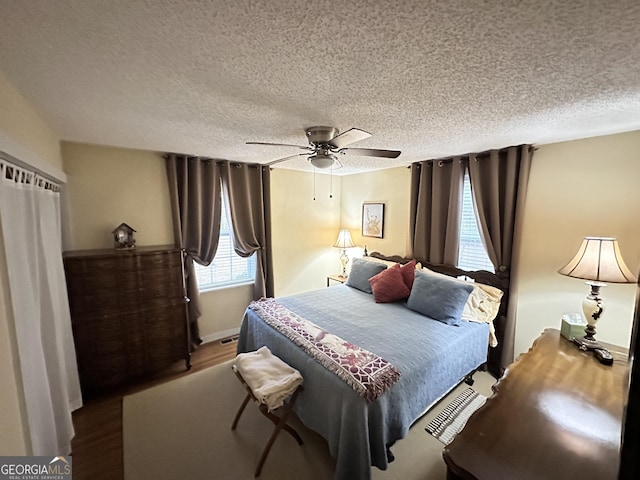 80 Hill Farm Rd, Alamo, GA 30411 - bedroom featuring a textured ceiling, wood finished floors, and a ceiling fan