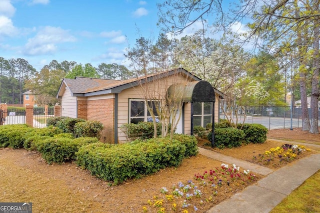 113 Brittany Ct, Duluth, GA 30096 - view of front facade featuring fence and brick siding