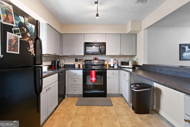113 Brittany Ct, Duluth, GA 30096 - kitchen featuring gray cabinets, dark countertops, a toaster, and black appliances