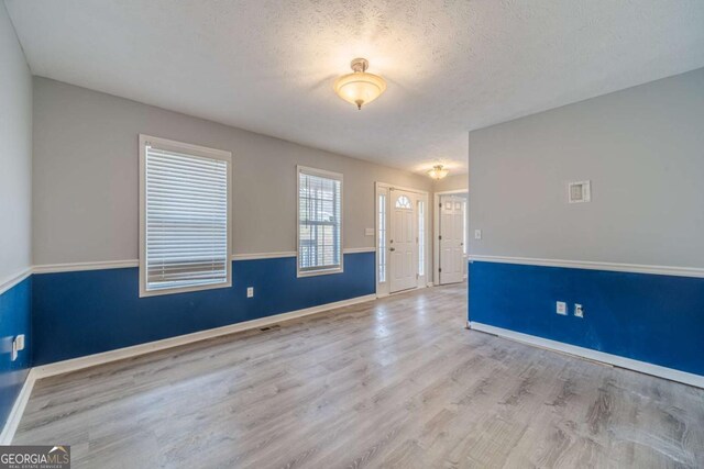 29 Monte Ln, Jefferson, GA 30549 - spare room with wood finished floors and a textured ceiling