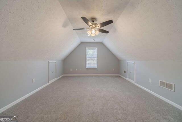 29 Monte Ln, Jefferson, GA 30549 - additional living space featuring a textured ceiling, a ceiling fan, carpet floors, and lofted ceiling