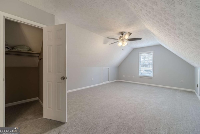 29 Monte Ln, Jefferson, GA 30549 - additional living space featuring carpet floors, a textured ceiling, ceiling fan, and vaulted ceiling