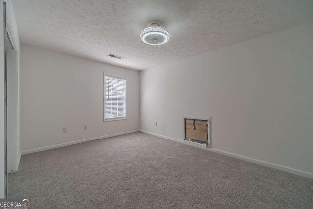 29 Monte Ln, Jefferson, GA 30549 - empty room with a textured ceiling and carpet