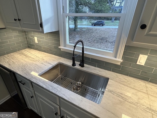 22 Edgewood Dr, Carrollton, GA 30116 - kitchen with a healthy amount of sunlight, a sink, backsplash, and light stone countertops