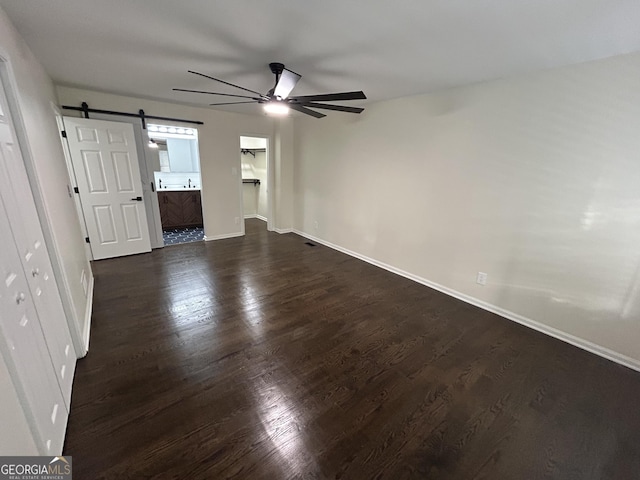 22 Edgewood Dr, Carrollton, GA 30116 - interior space with baseboards, a ceiling fan, and a barn door