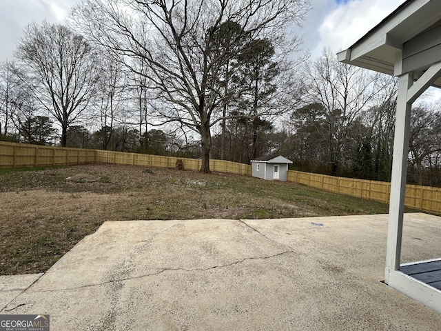 22 Edgewood Dr, Carrollton, GA 30116 - view of yard with a patio, a fenced backyard, a storage shed, and an outbuilding