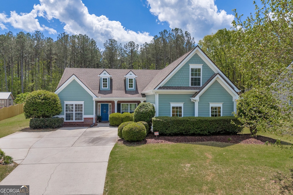 97 Kimberly Way, Hull, GA 30646 - view of front of home featuring brick siding, a front lawn, fence, and concrete driveway