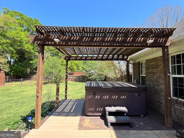 wooden deck featuring a yard, a pergola, fence, and a hot tub