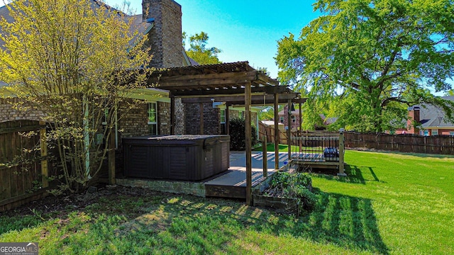 view of yard with a pergola, a fenced backyard, a deck, and a hot tub
