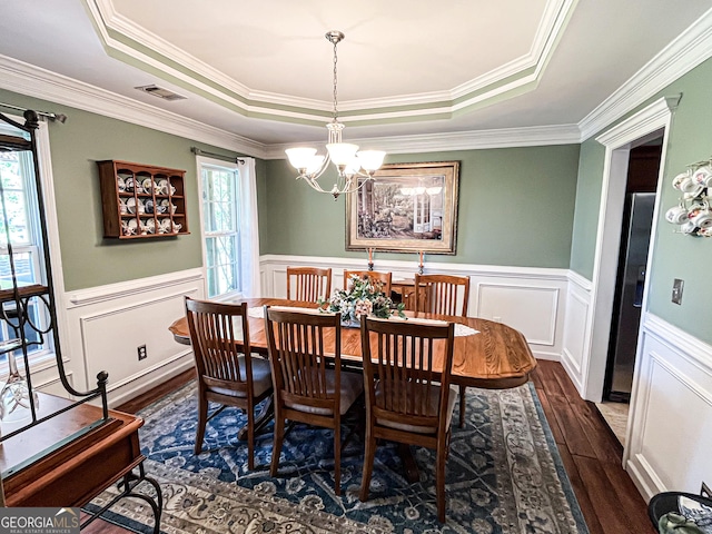 dining space with a chandelier, dark wood-style flooring, visible vents, and plenty of natural light
